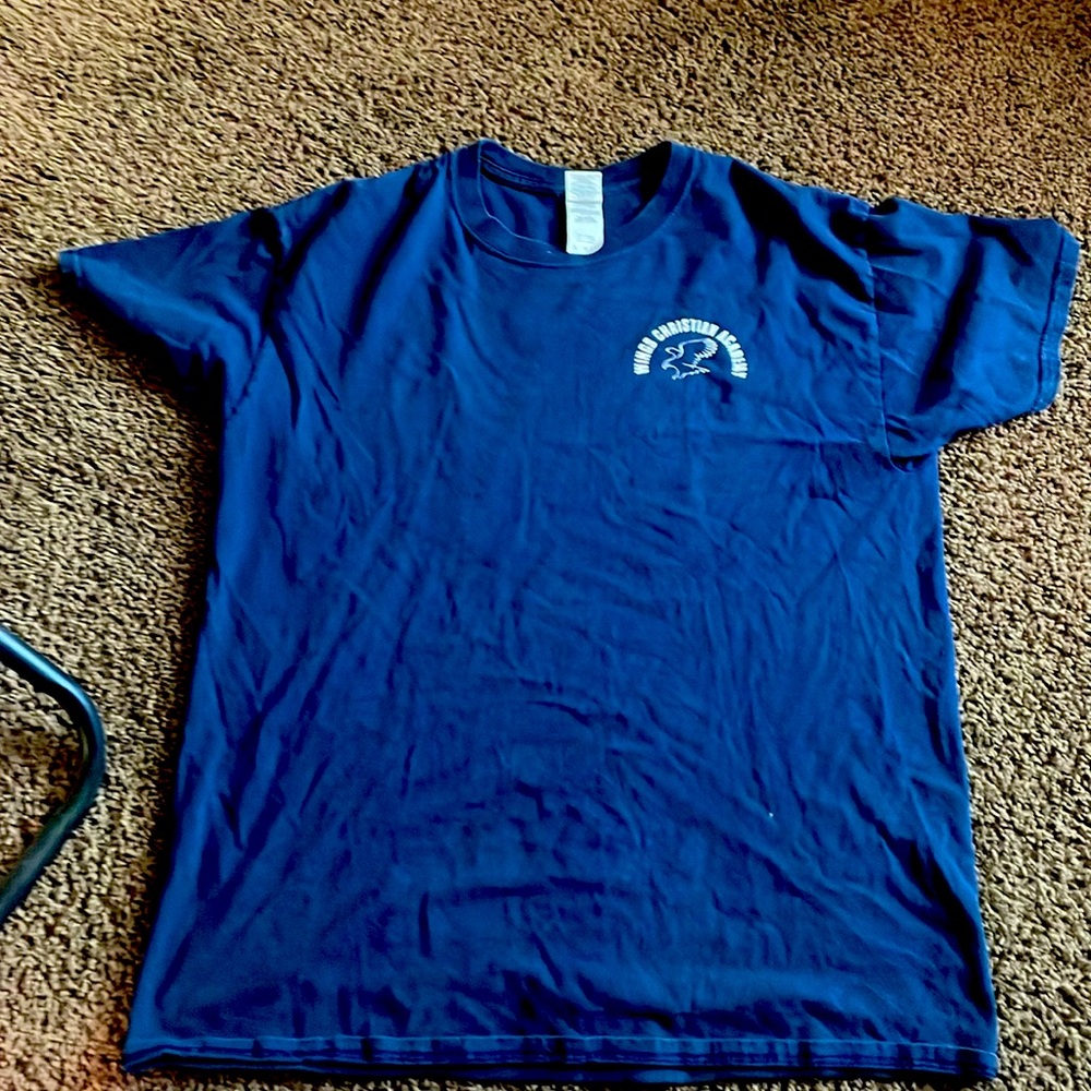 Wings Christian academy shirt, dark blue